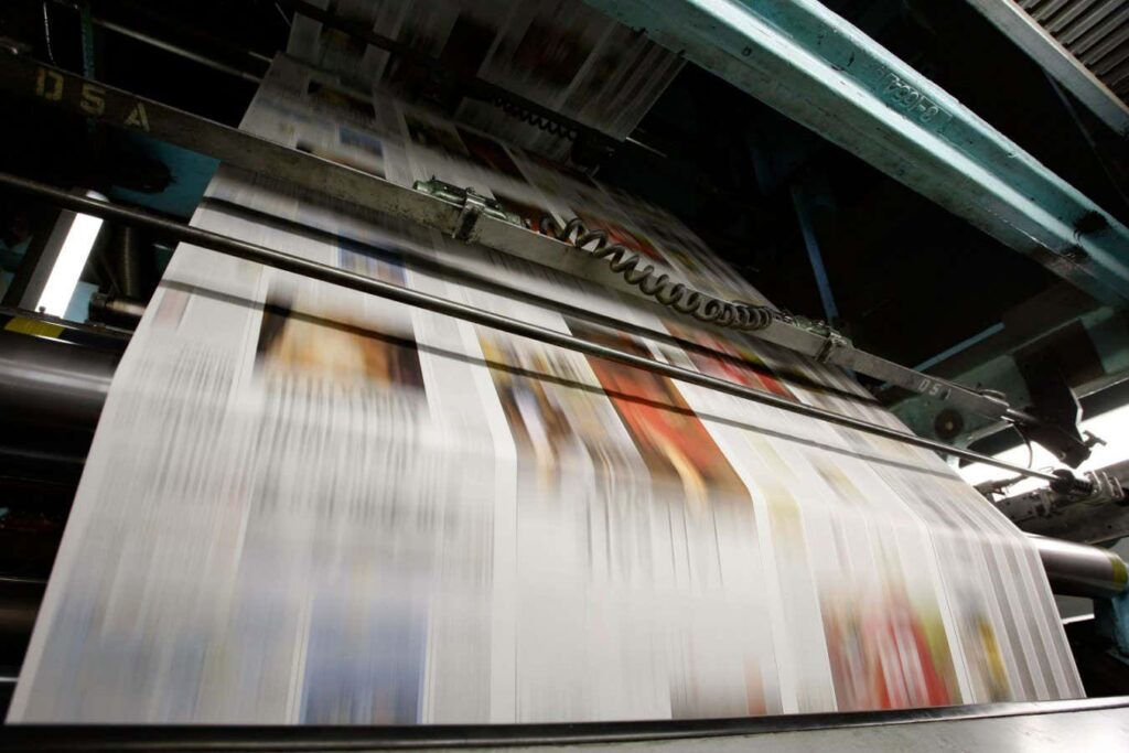 SAN FRANCISCO - SEPTEMBER 20: Freshly printed copies of the San Francisco Chronicle run through the printing press at one of the Chronicle